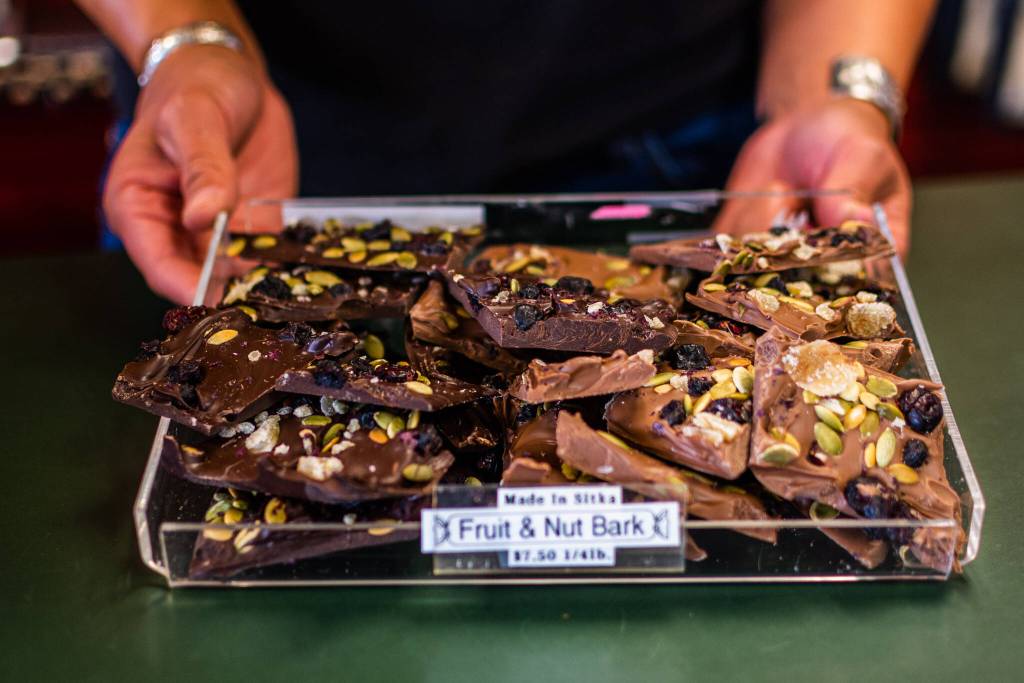 Learning how to make chocolate comes with a lot of trial and error. When Angela first bought the shop in 2017 she spent a month taking a chocolate crash course from Jackie Caywood, who used to own the shop. Angela is now passing on her chocolate-making knowledge by training her employee Gavi on how to make the delicious treats shown here. (Courtesy Photo / Lione Clare)