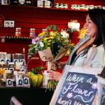 Angela Ketah holds a bright bouquet of fresh flowers for her business, Sitka Flower & the Chocolate Moose. Angelas dedication to her teams wellbeing and growth has helped her lead the way through the difficulties of the pandemic, setting an example for entrepreneurs around the region. (Courtesy Photo / Lione Clare)