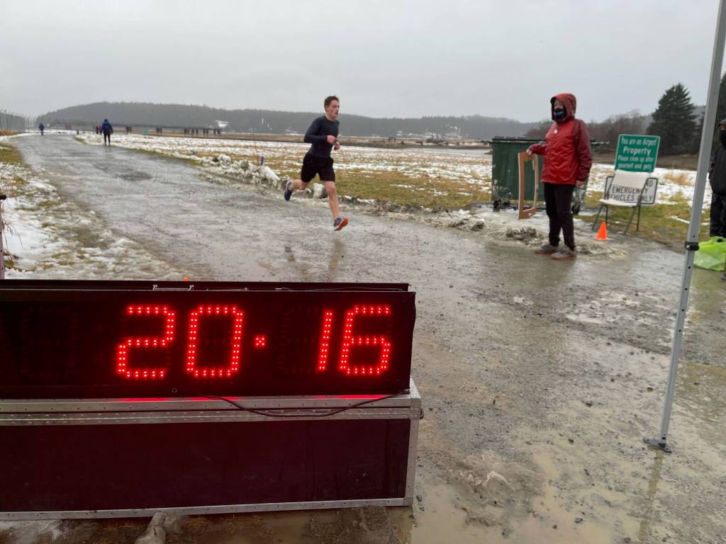 Kael Nord crosses the finish line at the eighth annual Turkey Trot 5K with a time of 20 minutes and 16 seconds. Scott McCain finished second with a time of 21:33, and Brandon Fost finished third with a time of 22:01. (Courtesy Photo / Tyra MacKinnon)