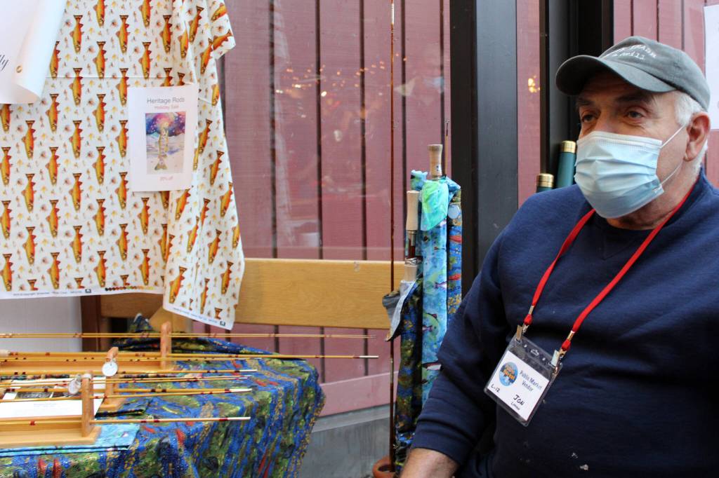 Jon Lyman sells bespoke fishing polls at Juneau Public Market on Friday, Nov. 26, 2021. (Dana Zigmund / Juneau Empire)