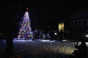 Choir group Floyd Dryden Eagles leads a crowd in the singing of Christmas carols at the Douglas Community United Methodist Church on Friday, Nov. 26, 2021, during the annual Christmas tree lighting ceremony. The Juneau 4th of July Parade Committee hosts the tree lighting each year in recognition of the two holidays - Christmas and the 4th of July - miners were given during Juneau's mining days. (Peter Segall / Juneau Empire)