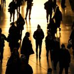 People pass through Waterloo train station, in London, during the morning rush hour, Monday, Nov. 29, 2021. The new potentially more contagious omicron variant of the coronavirus popped up in more European countries on Saturday, just days after being identified in South Africa, leaving governments around the world scrambling to stop the spread. No cases have yet been reported in Alaska, according to the Department of Health and Social Services. (AP Photo/Matt Dunham)