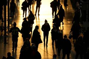People pass through Waterloo train station, in London, during the morning rush hour, Monday, Nov. 29, 2021. The new potentially more contagious omicron variant of the coronavirus popped up in more European countries on Saturday, just days after being identified in South Africa, leaving governments around the world scrambling to stop the spread. No cases have yet been reported in Alaska, according to the Department of Health and Social Services. (AP Photo/Matt Dunham)
