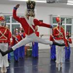 Viktor Bell rehearses his role in The Nutcracker on Saturday, Nov. 27. Lead soldiers Grace Bultez and Ainsley Mallott stand guard. (Ben Hohenstatt/Juneau Empire)