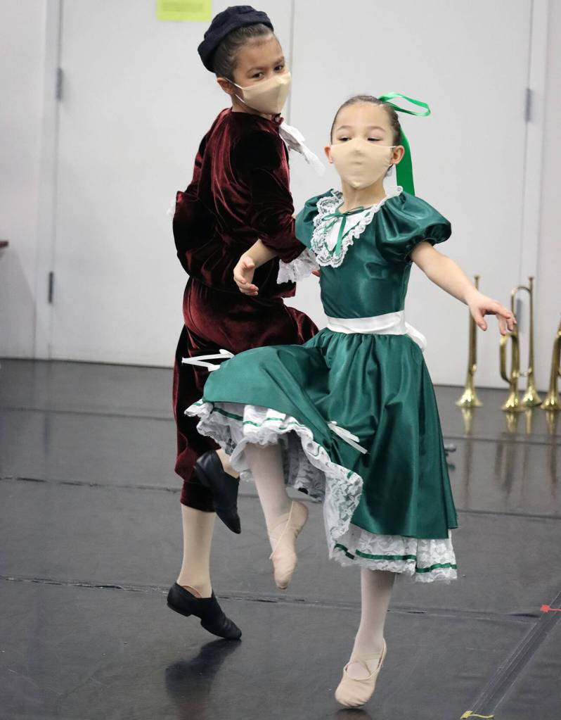 Brigitte Ouellette rehearses the role of Fritz along with Sachiko Marks, who is portraying a party goer in The Nutcracker rehearsal on Saturday, Nov. 27. (Ben Hohenstatt/Juneau Empire)