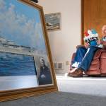 Pearl Harbor survivor and World War II Navy veteran David Russell, 101, reads a birthday card while talking about his time aboard the USS Oklahoma and his life after the war on Monday, Nov. 22, 2021, in Albany, Ore. (AP Photo/Nathan Howard)