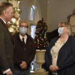 Gov. Mike Dunleavy, left, meets with City and Borough of Juneau Mayor Beth Weldon, right, and City Manager Rorie Watt, center, at a Christmas open house event at the Alaska Governors Mansion on Dec. 7, 2021. (Peter Segall / Juneau Empire)