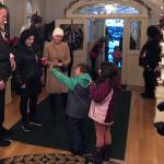 Children wave goodbye to Gov. Mike Dunleavy at a Christmas open house event at the Alaska Governors Mansion on Tuesday, Dec. 7, 2021. The event was suspended in 2020 due to COVID-19 but returned this year with slight health mitigation alterations. The event was well-attended by Juneau families. (Peter Segall / Juneau Empire)