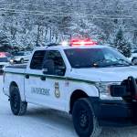 Vehicles convoy to Fred Meyer as Juneau law enforcement officials drive children to go shopping during the annual Shop with a Cop event on Dec. 18, 2021. (Michael S. Lockett / Juneau Empire)