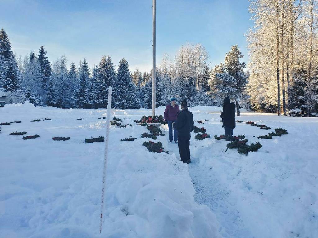 Courtesy photo / American Legion Post 25 
Members of the American Legion Post 25 lay wreaths in a circle Alaska Memorial Park on Dec. 18, 2021 in concert with Wreaths Across America ceremonies nationwide. The group also laid wreaths at the Shrine of St. Therese and Evergreen Cemetery that day.