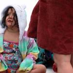 Juniper Harris, 6, dries off following the Polar Dip on Saturday. It was Harris first time taking the dip. The event is a long-running Juneau tradition. She really wanted to after last year, said Stephenie Harris, Junipers mom. She said Juniper skipped skiing to be there. (Ben Hohenstatt / Juneau Empire)