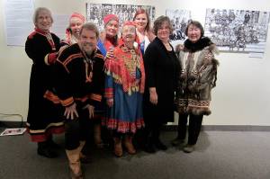 Sámi Reindeer People exhibit opening in Vesterheim Norwegian American Museum, Decorah, Iowa. L to R: Marlene Wisuri, Cari Mayo, Nathan Muus, Faith Fjeld, Lois Stover (Sara, Twitchell, Kvamme original Sámi herder families), Marie Olson, Nancy Olson, Pearl Johnson. (Courtesy Photo / Nathan Muus)