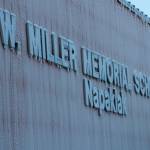 This December 2019 photo shows frost hanging off the sign of the William Miller Memorial School, a public school in Napakiak, Alaska. The school that is in danger of being lost to erosion because of climate change is at the top of the states list for the construction of a new school building. The Alaska Department of Education and Early Development put the school in the southwest Alaska village of Napakiak at the top of its priority list for replacement for the upcoming fiscal year, KYUK-AM reported. (AP Photo / Mark Thiessen)