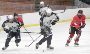 Soldotnas Gehret Medcoff prepares to enter the zone with teammate Daniel Heath against Juneau-Douglas on Thursday, Jan. 6, 2022, at the Soldotna Regional Sports Complex in Soldotna, Alaska. (Photo by Jeff Helminiak/Peninsula Clarion)