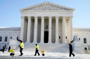 The Supreme Court shown Friday, Jan. 7, 2022, in Washington. The Supreme Court is taking up two major Biden administration efforts to bump up the nation's vaccination rate against COVID-19 at a time of spiking coronavirus cases because of the omicron variant. (AP Photo/Evan Vucci)