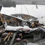 The roof of a building on Willoughby Avenue in downtown Juneau collapsed Tuesday, Jan. 11, 2022, one of two buildings in the city to fall in amid continuing rain following heavy snowfall. No injuries were reported at either location. (Peter Segall / Juneau Empire)
