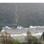 The Norwegian Encore sails past Douglas Island on Sept. 8, 2021. Norwegian Cruise Line hopes to build a cruise ship dock on its waterfront property on Egan Drive. The city is considering amending the 2004 Long Range Waterfront Plan to allow the new dock. If the change is approved, it could clear the way for broader discussions with NCL. (Dana Zigmund/Juneau Empire)