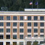 The U.S. Flag and Alaska state flag fly on the roof of the Alaska State Capitol on Saturday, Oct. 17, 2020. (Ben Hohenstatt / Juneau Empire File)