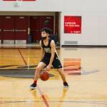 Alwen Carrillo, one of the Juneau-Douglas High School: Yadaa.at Kalé boys basketball team captains, dribbles during practice on Dec. 15, 2021. (Michael S. Lockett / Juneau Empire File)