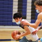 Isaiah Nelson drives against Thomas Baxter during practice at Thunder Mountain High School. (Ben Hohenstatt / Juneau Empire File)