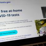 A United States government website is displayed on a computer, Wednesday, Jan. 19, 2022, in Walpole, Mass., that features a page where people can order free, at-home COVID-19 tests. The website, COVIDTests.gov, allows people to order four at-home tests per residence and have them delivered by mail. (AP Photo/Steven Senne)