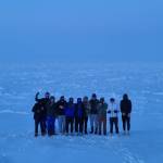 The Thunder Mountain High School boys basketball team stand on the Arctic Ocean. (Courtesy Photo)
