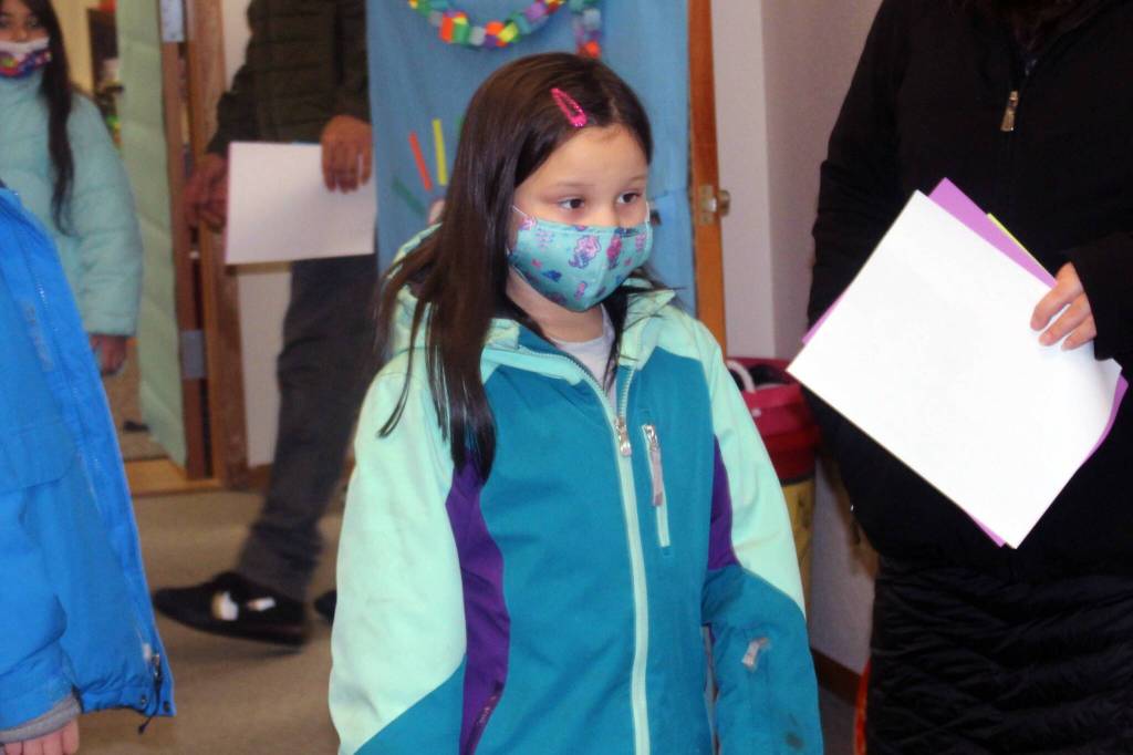 Emma Tripp, 8, checks out her new second grade classroom on Jan. 21. Tripp, along with other students and staff from Riverbend Elementary School will gather in the education wing of Chapel by the Lake while crews repair damage from a burst pipe at Riverbend Elementary School. (Dana Zigmund/Juneau Empire)
