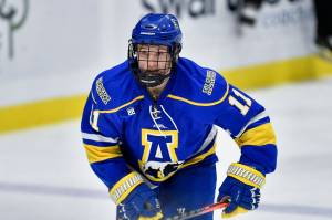 FILE - Alaska Nanooks forward Brady Risk plays during the third period of an NCAA hockey game against Cornell on Friday, Oct. 29, 2021 in Ithaca, N.Y. When the Alaska Nanooks ventured out from campus in Fairbanks for their second three-week road trip of the season, a simple stop in Seattle turned into a four-day stay as virus-related airline staff shortages and wintry weather in the region grounded flight after flight. (AP Photo/Adrian Kraus, File)