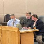 Investigator Markus Bressler, defendant John Stapleton, and public defender Eric Hedland sit in court on Jan. 13, 2022. (Michael S. Lockett / Juneau Empire File)