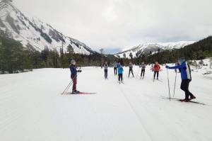 Maddie Phaneuf, a Team USA biathlete, coaches up Juneau Nordic Ski Team members during a recent stop in the capital city. Phaneuf said it was only her second time in Alaska. Despite heavy rain, local athletes were able to learn from the Olympic-caliber athlete. (Courtesy Photo / Mike Justa)