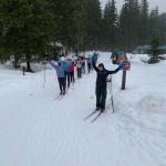 Courtesy Photo / Tristan Knutson-Lombardo 
Maddie Phaneuf, a Team USA biathlete, stands at the front of a line of skiers with her arms outstretched. Phaneuf was recently in town as a guest coach for Juneau Nordic Ski teams. Coaches said its excited to bring in professionals with outside perspective.