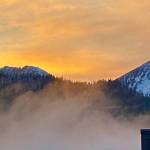 Fog rises in an attempt to obscure the golden glow above the Douglas range on Jan. 31. (Courtesy Photo / Denise Carroll)