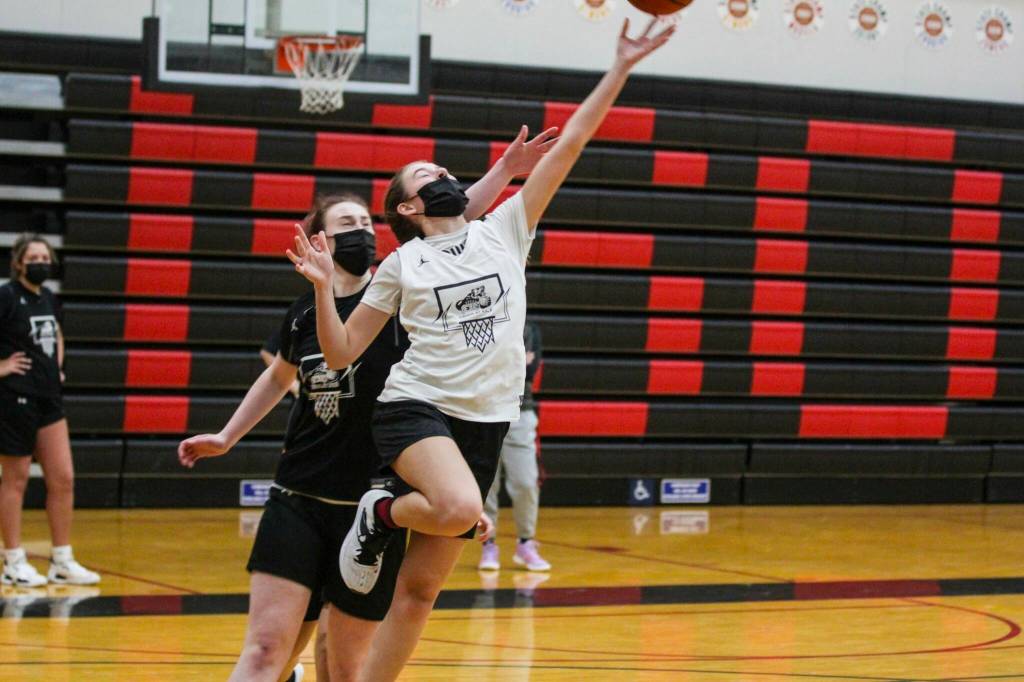 Players on the Juneau-Douglas High School: Yadaa.at Kalé girls basketball team practice on Dec. 15, 2021. The JDHS girls will play Thunder Mountain on Feb. 4 and 5. (Michael S. Lockett / Juneau Empire File)