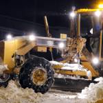 A city-owned grader moves snow before dawn on Feb. 4 on Tongass Boulevard in the Mendenhall Valley. City snow removal crews have been challenged by multiple winter storms and higher-than-average snowfall. (Ben Hohenstatt/Juneau Empire)