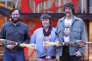 Ketchikan resident Jack Finnegan, left, owner of Fishability, and Bonnie, center, and Stormy Hamar, who own Kasaan Arts, Museum, and Canoes stand outside the Sealaska Heritage Building on Feb. 8. Earlier Tuesday, each business owner was named a winner of the Path to Prosperity contest, put on by nonprofit Spruce Root. (Dana Zigmund/Juneau Empire)