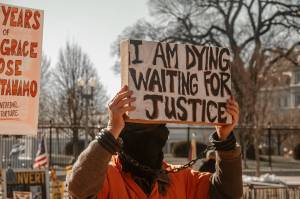 Demonstrators outside the White House on January 11, 2022, commemorating the 20th anniversary of the Guantanamo Bay Detention Center. (Maria Oswalt / Unsplash)