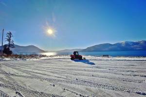Kéet and Oscar walk the bike path after its plowed. (Vivian Faith Prescott / For the Capital City Weekly)