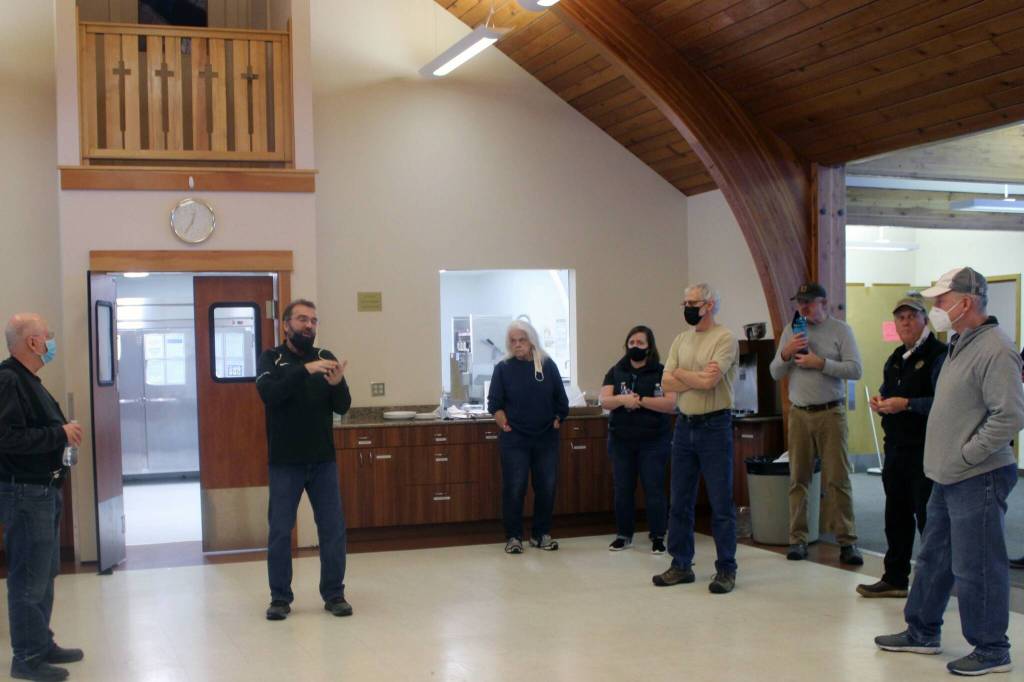 Tim Harrison, pastor at Chapel by the Lake church, addresses a group of volunteers on Jan. 17. The volunteers were on hand to help prepare the churchs education wing for students from Riverbend Elementary School who will use the building to learn while their school building is repaired from damage that resulted from a broken pipe. (Dana Zigmund/Juneau Empire)
