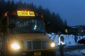 A bus full of students from Riverbend Elementary School arrives for the first day of classes at the school's temporary location at Chapel by the Lake in Auke Bay on Jan. 24. (Dana Zigmund/Juneau Empire)