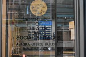 The entrance to the Alaska Department of Health and Social Services building in downtown Juneau on Jan. 14, 2021. Gov. Mike Dunleavy has twice proposed splitting the department using an executive order, but the Division of Legislative Legal Services has raised issues with the most recent order. (Peter Segall / Juneau Empire file)
