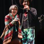 Rosita Worl, president of the Sealaska Heritage Institute, celebrates the performance of hip-hop duo of Arias A.J. Hoyle, right, and Chris Talley as an opening act before Khu.eex performance at Centennial Hall on Monday, Jan. 28, 2019. (Michael Penn / Juneau Empire File)