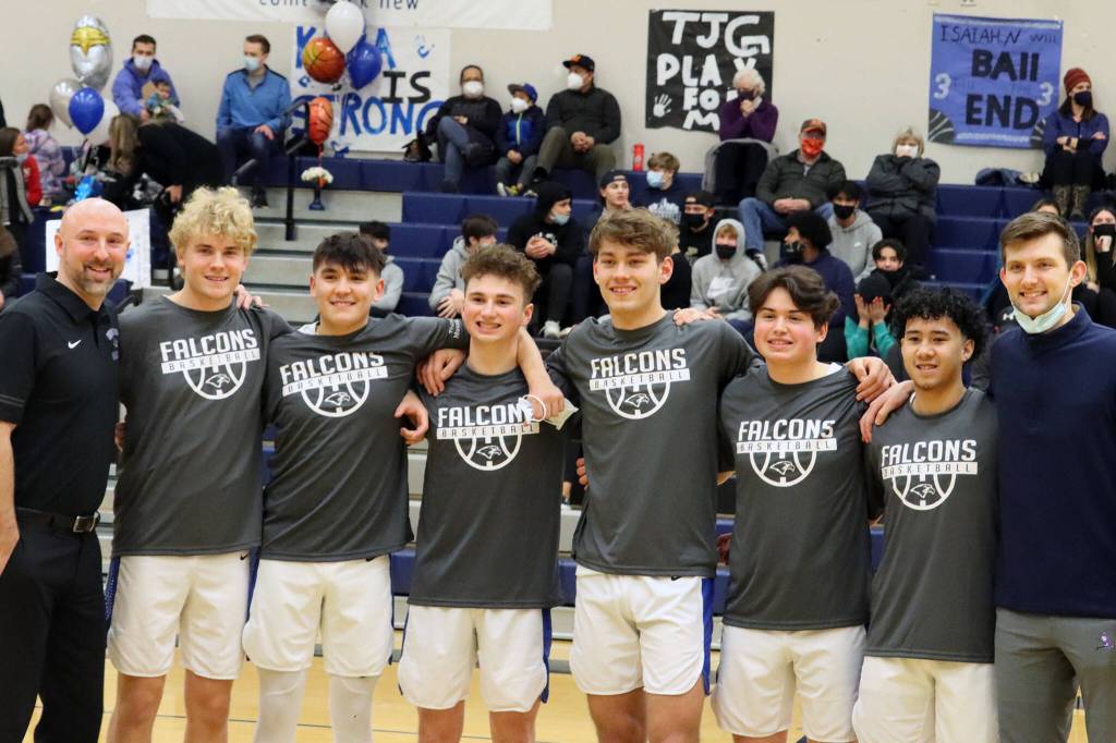 Ben Hohenstatt / Juneau Empire
Coaches John Blasco (far right) and Matt Seymour (far left) flank seniors (from left to right) Noah Chambers, Isaiah Nelson, Matthew Johns, Wallace Adams, Matthew Hartsock and Storm Aguirre.