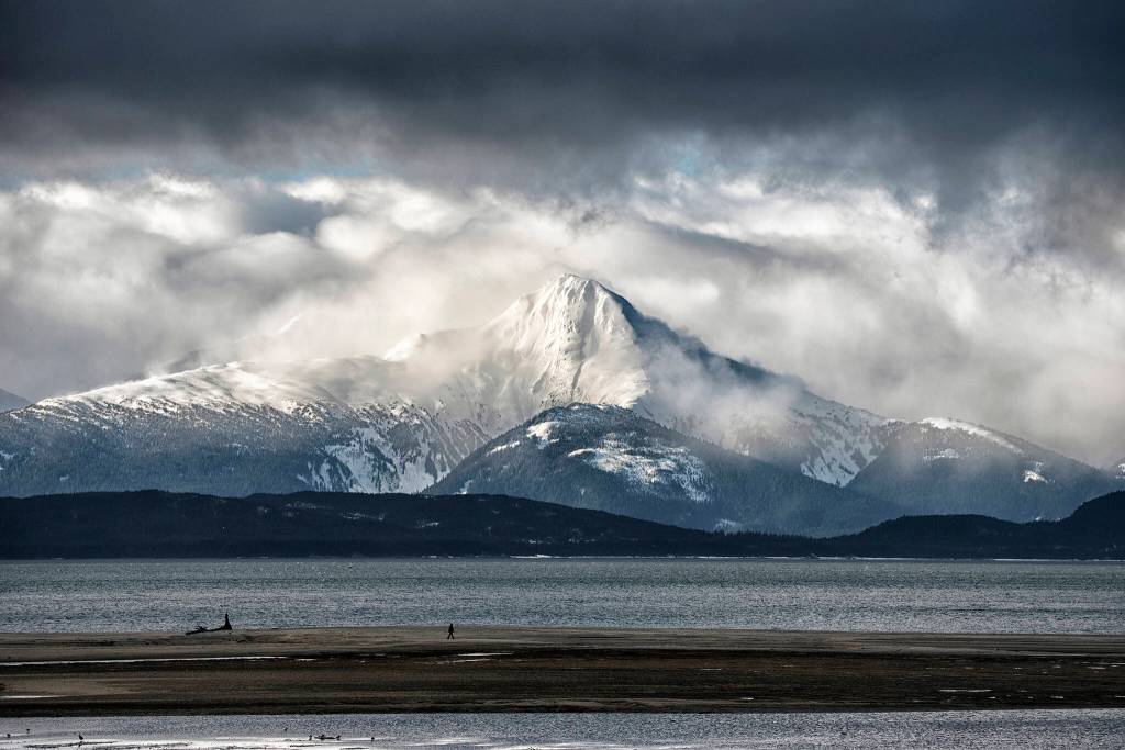 This photo shows the view from Eagle Beach looking across to Mount Golub emerging through the cloud, with Lincoln Island in the foreground. (Courtesy Photo / Kenneth Gill, gillfoto)