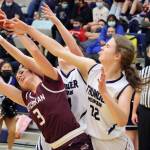 Ketchikans Paige Boehlert (3) and Thunder Mountains Keidre Hartman (24) and Kerra Baxter (22) pursue the ball during Saturdays game at Thunder Mountain High School. (Ben Hohenstatt / Juneau Empire)