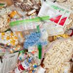 In this September 2019 Empire file photo, prescriptions drugs, vitamins, hormones, and other drugs left in the drug drop box in the lobby of the Juneau Police Department are displayed. (Michael Penn / Juneau Empire file)