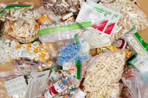 In this September 2019 Empire file photo, prescriptions drugs, vitamins, hormones, and other drugs left in the drug drop box in the lobby of the Juneau Police Department are displayed. (Michael Penn / Juneau Empire file)