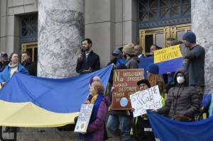 Peter Segall / Juneau Empire 
Rep. Zack Fields, D-Anchorage, speaks during a rally urging the Alaska government, particularly the Permanent Fund Corporation, to divest itself from any Russian investment.