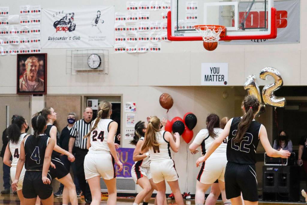 JDHS' Mila Hargrave (24) sinks a shot during a game against TMHS on March 5, 2022. (Michael S. Lockett / Juneau Empire)