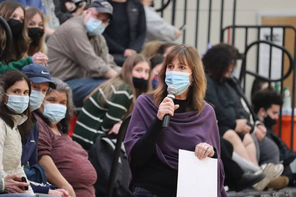 Juneau School District Superintendent Bridget Weiss speaks at halftime of the JDHS-TMHS game on Friday. The game was the second annual Take a Timeout to Talk - Suicide Prevention Awareness game. Weiss, like coaches and players, wore purple. Purple Purple and turquoise are colors associated with suicide prevention and awareness. (Ben Hohenstatt / Juneau Empire)
