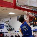 TMHS Thomas Baxter, a sophomore, throws down a dunk to score two of his game-high 29 points on Friday night at Juneau-Douglas High School: Yadaa.at Kalé. (Ben Hohenstatt / Juneau Empire)